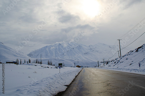 winter landscape with road and blue sky
