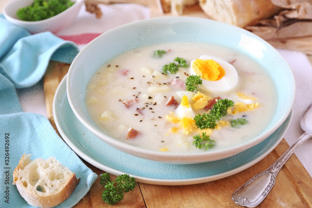Traditional polish soup Zurek. Sour soup with sausage, potatoes and eggs Traditional polish soup Zurek. Sour soup with sausage, potatoes and eggs
