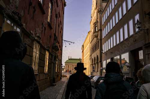 Streets in Stockholm with adjacent buildings along the entire road; Narrow and wide streets in the old town outdoors