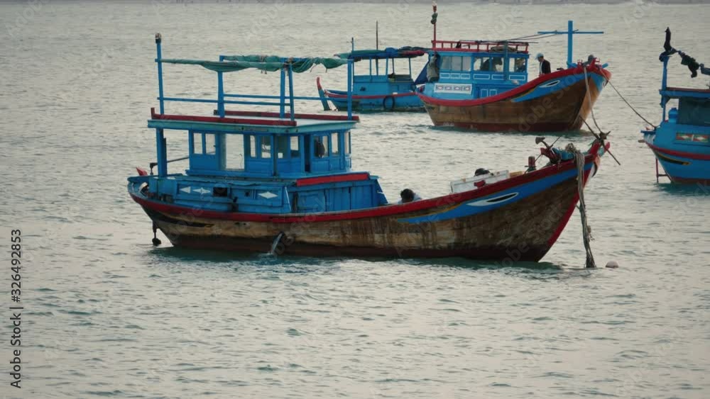 Blue fishing boats in harbor in Vietnam Blue fishing boats in harbor in Vietnam
