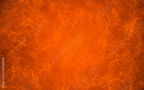 Orange background with marble texture with scratches and scuffs. The background has a gradient.