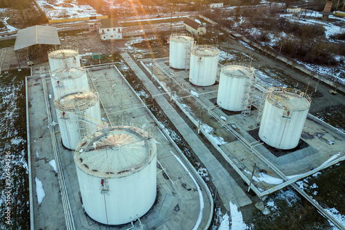 Aerial view of big fuel reservoires in petrol industrial zone in winter. photo