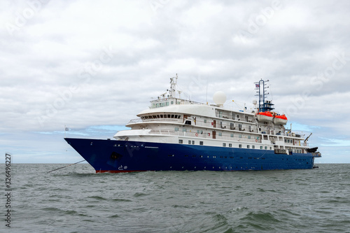 Blue cruise ship at sea. Passenger vessel.  © Alexey Seafarer