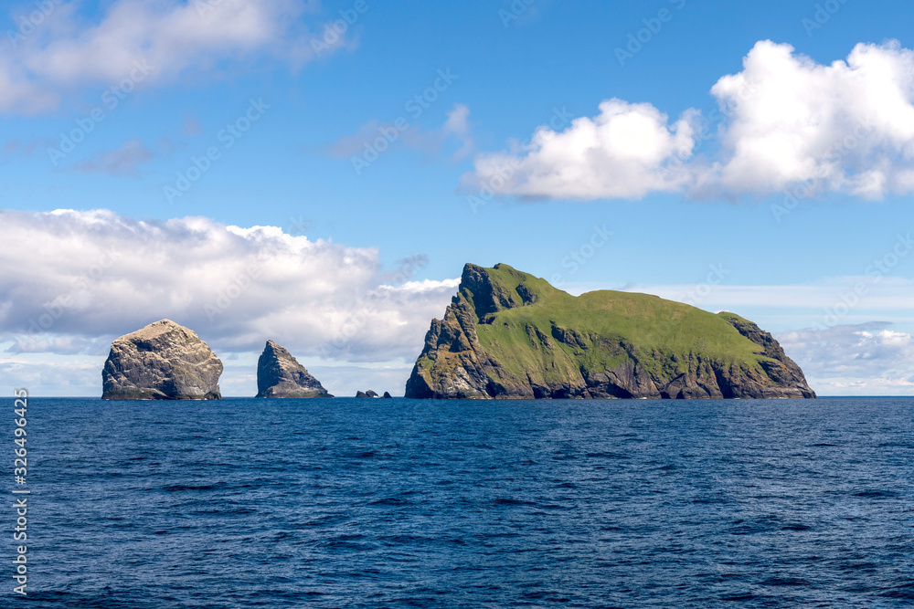 Green islands at sea in Scotland, United Kingdom.