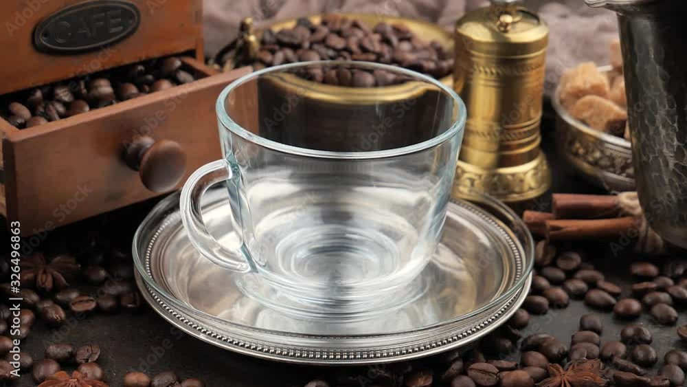Black coffee is poured into a cup Black coffee is poured into a cup