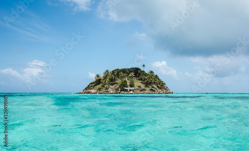 Intense turquoise water around Crab Cay, a small rock off Isla de Providencia, one of Colombia's paradise Caribbean islands