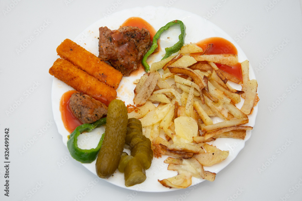 platter with French fries, pickles and fish