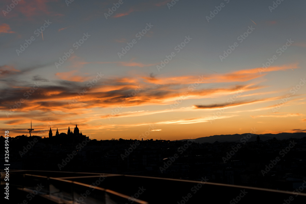 Image of the sunset in the city of Barcelona with monjuic mountain silhouette Image of the sunset in the city of Barcelona with monjuic mountain silhouette