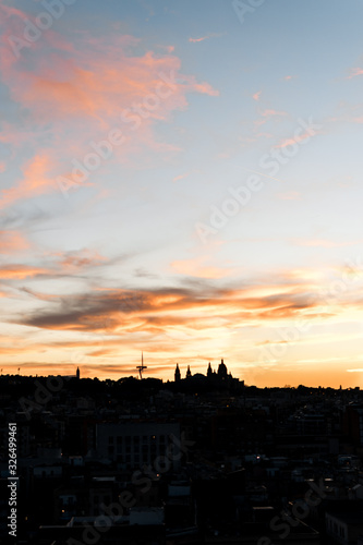Image of the sunset in the city of Barcelona with monjuic mountain silhouette