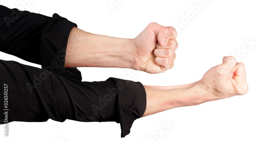 Tableau sur toile male hands in rolled up sleeves of a black shirt with clenched fists