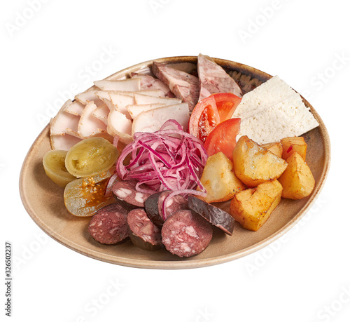 assorted on a plate, from bacon, blood, sausage, ham and grilled potato with pickled vegetables isolated on a white background. photo for the menu.