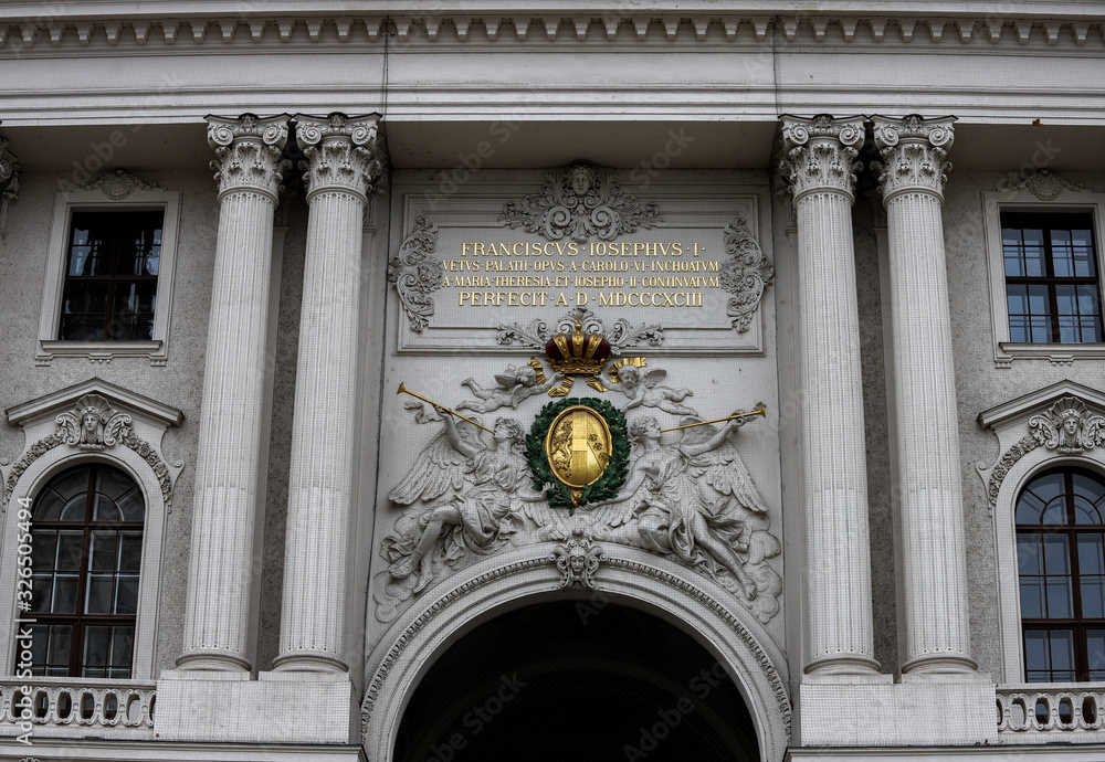 Reliefs and two pairs of columns at the entrance of the Hofburg Imperial Palace, Michaelerplatz in Vienna, Austria.