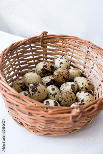 quail eggs in a wicker basket. Easter and easter decoration