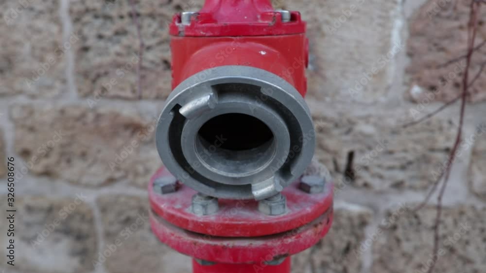 fire hydrant or crane on a stone wall background fire hydrant or crane on a stone wall background
