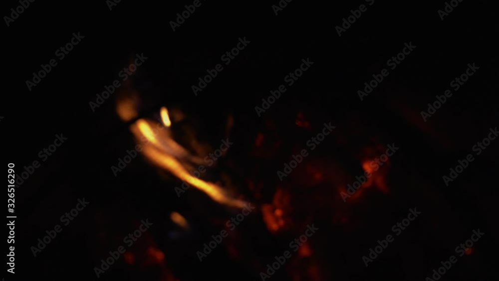 Blurry background. Flames of burned wood in the fireplace. Close-up. Blurry background. Flames of burned wood in the fireplace. Close-up.