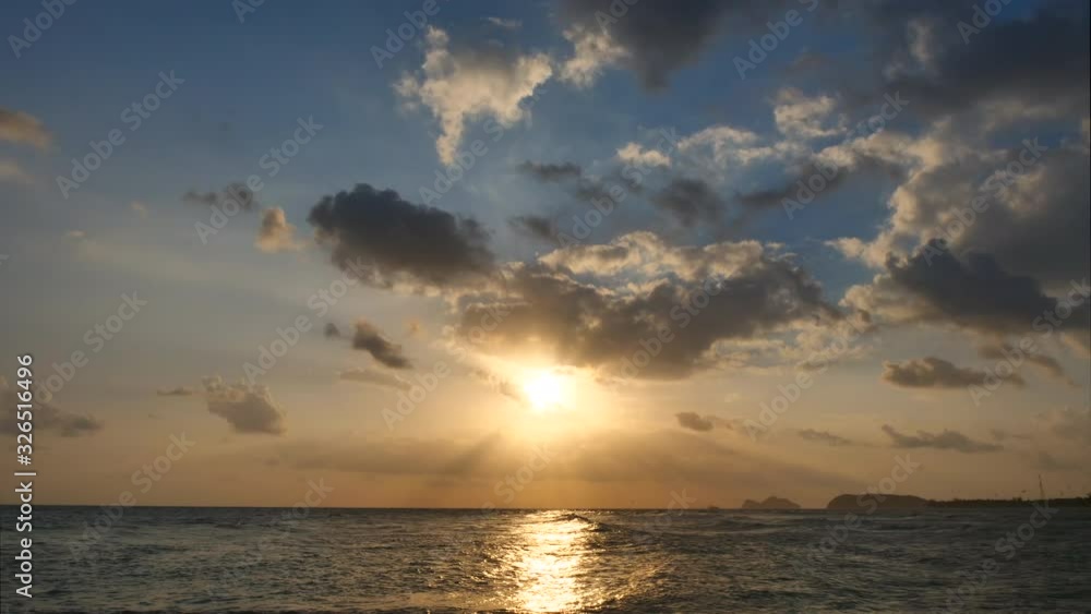 Time Lapse of Sunset with moving clouds above the seascape Time Lapse of Sunset with moving clouds above the seascape