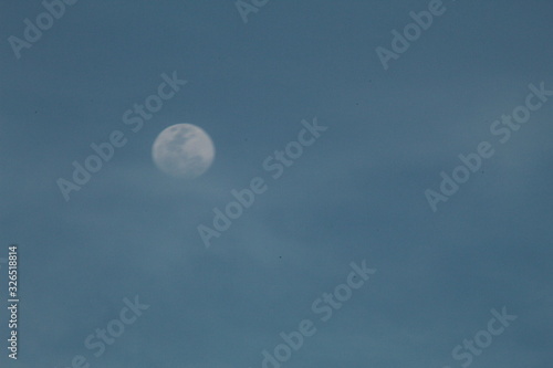  the moon in a late afternoon