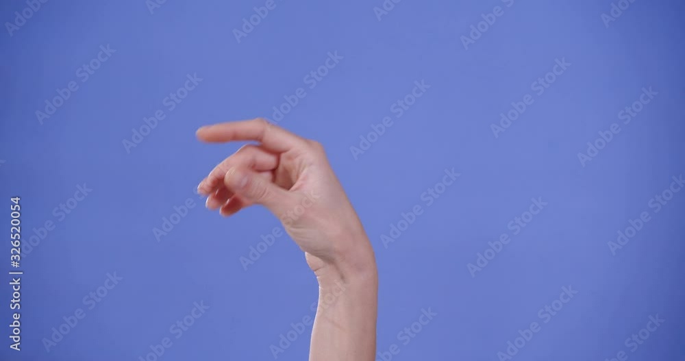 Woman showing P letter on blue background, closeup. Sign language Woman showing P letter on blue background, closeup. Sign language