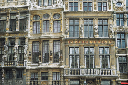 Architectural detail of historical European buildings, including Le Renard, Le Cornet, and La Louve in the Grand Place, Brussels, Belgium © PeskyMonkey