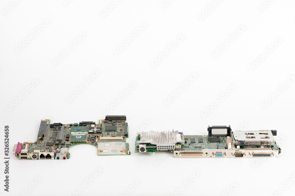 Comparing two laptop mother boards, one from 2003, one from 1999 Comparing two laptop mother boards, one from 2003, one from 1999