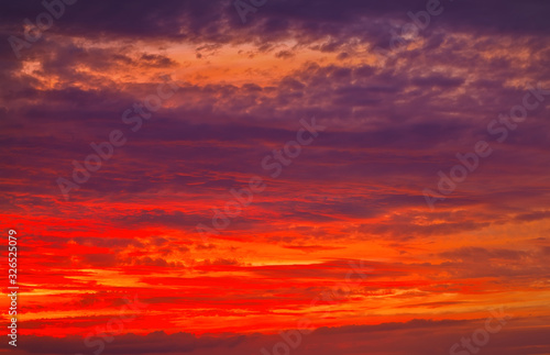 Beautiful Twilight sky background. Colorful Fiery orange and red sunset sky.