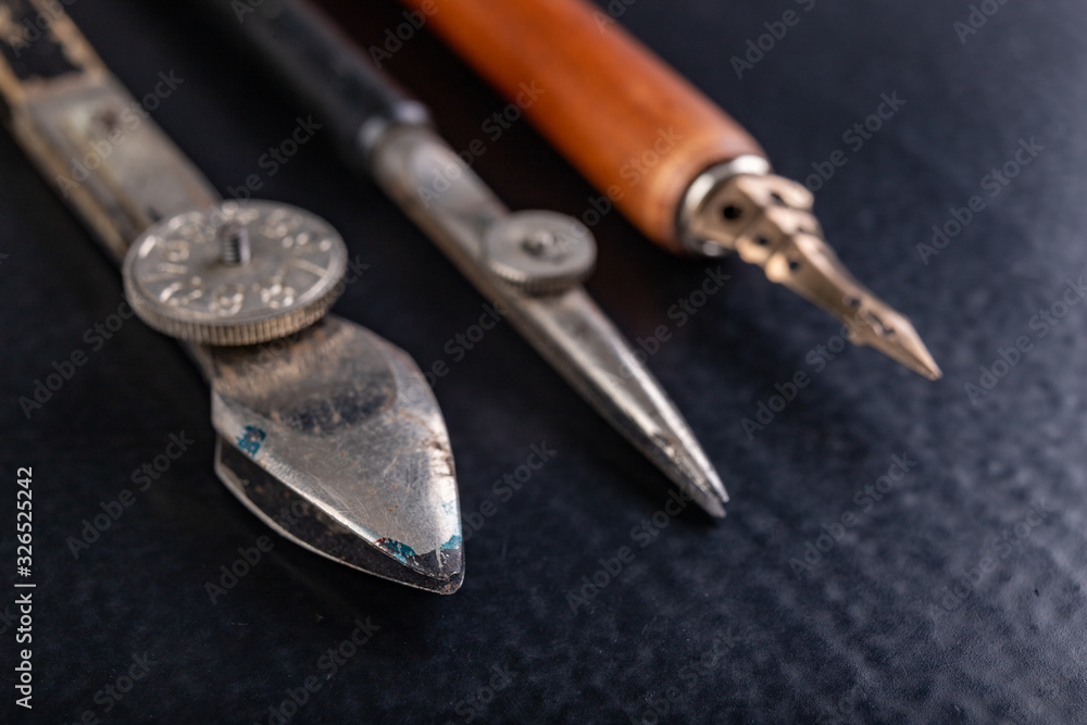 Calligraphy nibs arranged on a table. Old accessories for decorating and hand writing. Calligraphy nibs arranged on a table. Old accessories for decorating and hand writing.