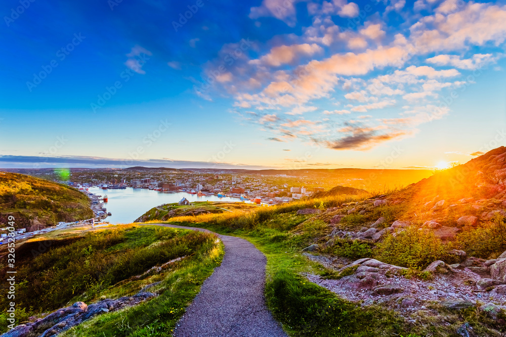 View of St John city from Signal Hill at Newfoundland, Canada with sunset sky as background during summer View of St John city from Signal Hill at Newfoundland, Canada with sunset sky as background during summer