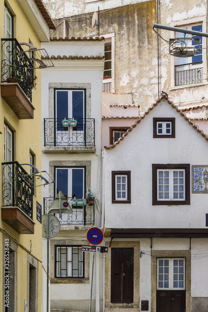 Charming houses and weathered facades in Alfama, Lisbon, Portugal