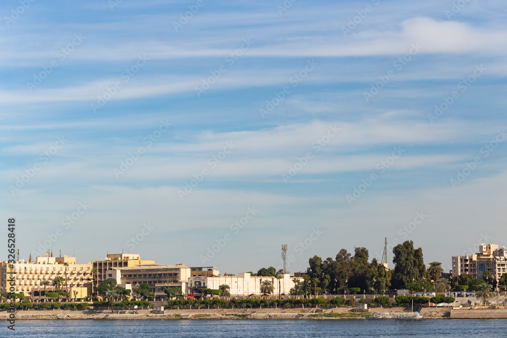 Luxor, Egypt, Karnak Temple, complex of Amun-Re. View of the ancient city of Thebes from the Nile. Panoramic city, view from the river. Luxor, Egypt, Karnak Temple, complex of Amun-Re. View of the ancient city of Thebes from the Nile. Panoramic city, view from the river.