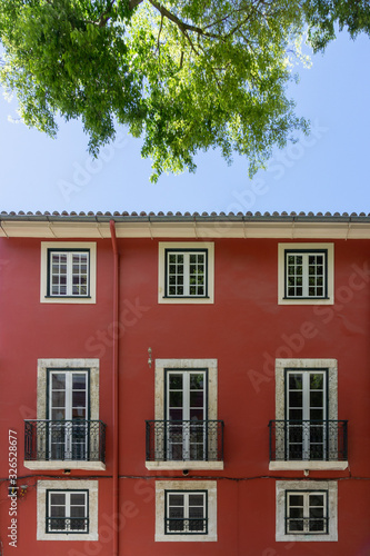 Old Building with red facade in Lisbon, Portugal.