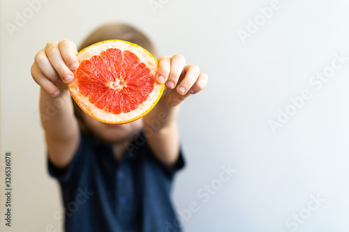 grapefruit in hand, space for text