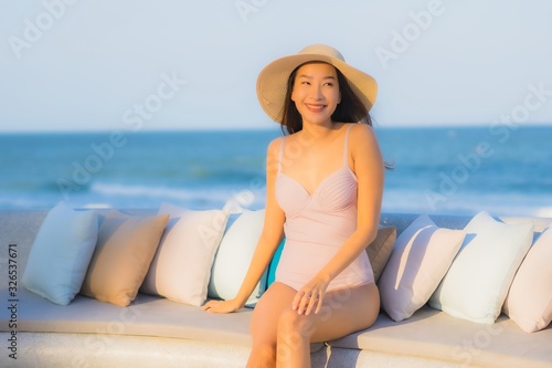 Portrait beautiful young asian woman happy smile around sea ocean beach
