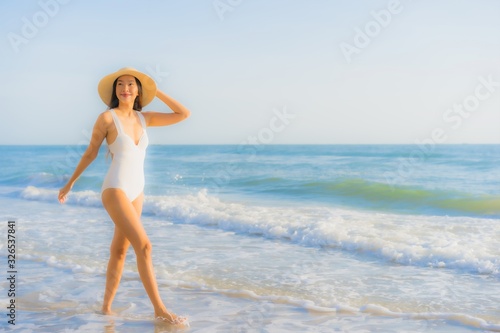 Portrait beautiful young asian woman happy smile around sea ocean beach