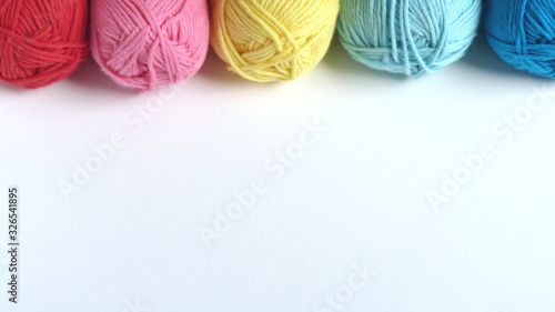 Colorful Yarn on a White Background | Red, Pink, Yellow, and Blue Yarn