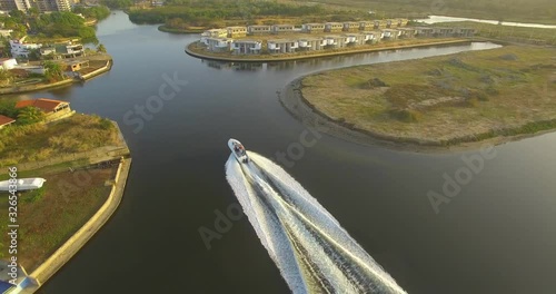 Aerial view of a yacht sailing in the Hiterote canals, Venezuela, during the golden hour photo
