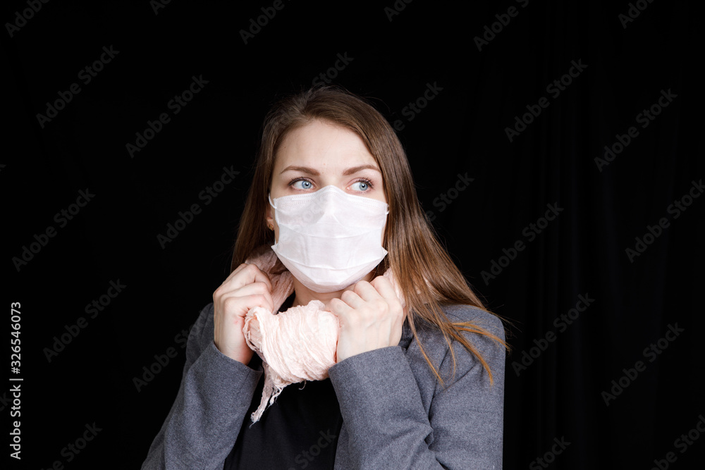 Coronavirus in China. Novel coronavirus (2019-nCoV), woman in white medical face mask. Concept of coronavirus quarantine Coronavirus in China. Novel coronavirus (2019-nCoV), woman in white medical face mask. Concept of coronavirus quarantine