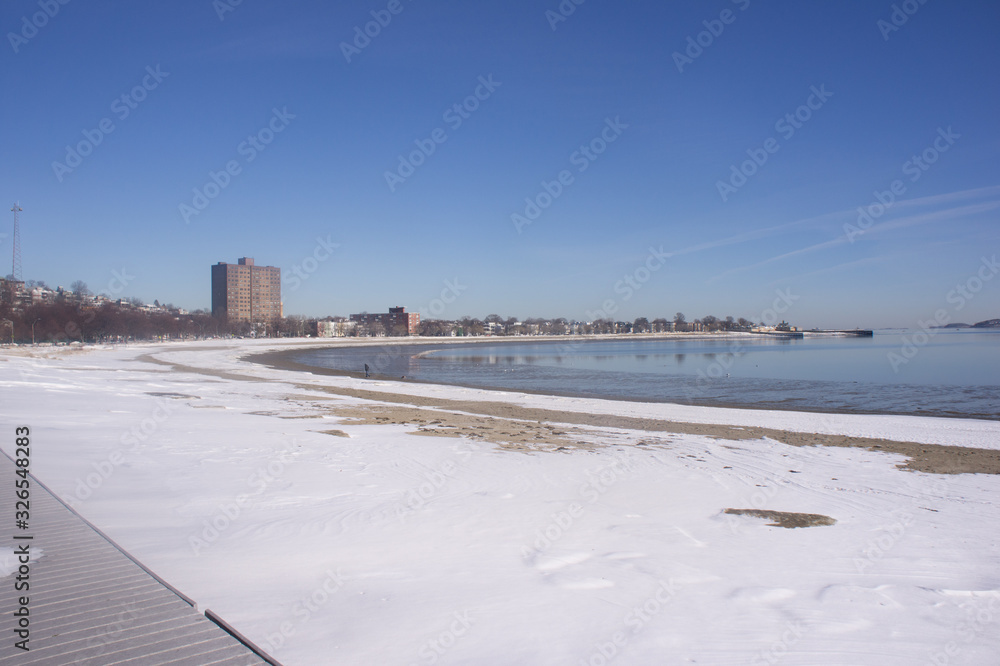 View of Boston's coastline from Carson Beach in winter