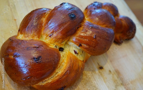 A braided challah brioche bread with raisins photo