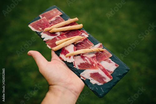 Tableau sur toile Typical Iberian ham top of Spain