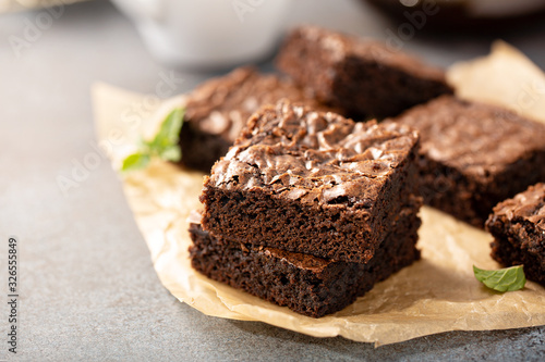 Cuadro en lienzo Freshly baked homemade brownies on a parchment paper