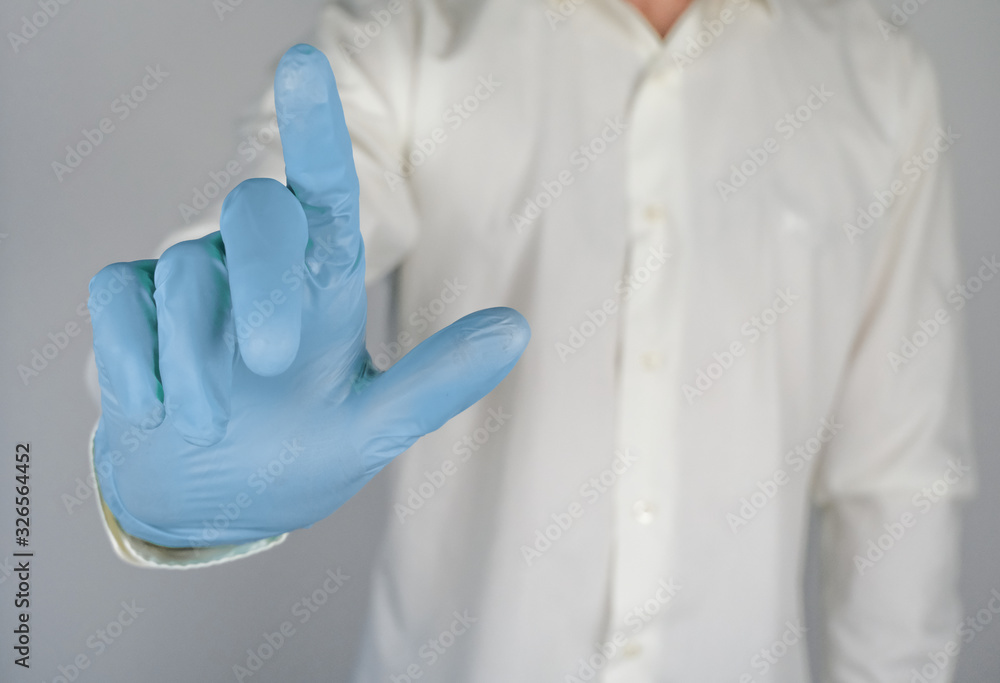 Man painting his finger up, close up, man wearing rubber gloves. Man painting his finger up, close up, man wearing rubber gloves.