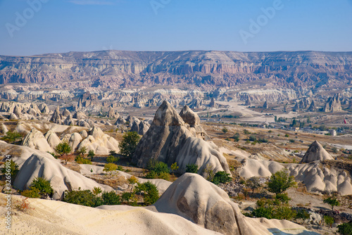 Rock formations of mountain ridges, valleys and pinnacles at Göreme National Park, Cappadocia, Turkey photo