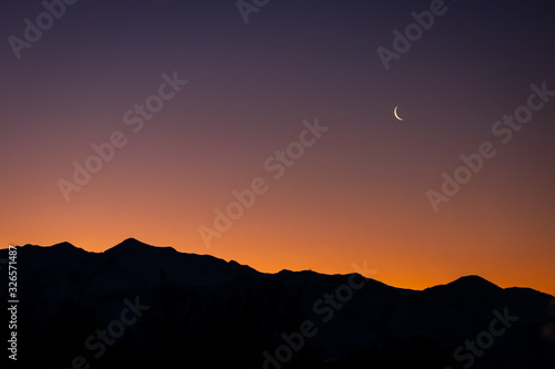 Beautiful morning sunrise over silhouette of Utah mountain range