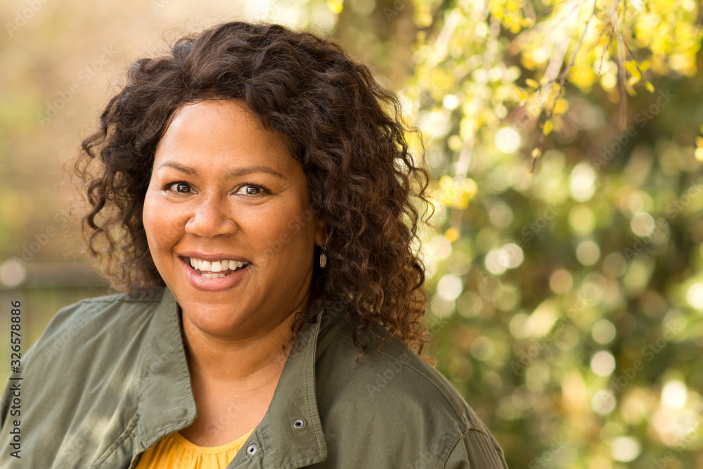 Beautiful mature African American woman smiling and laughing. Beautiful mature African American woman smiling and laughing.