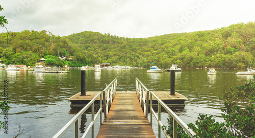 Scenic landscape view of a jetty on Berawa Creek located in Sydney's northern suburbs Australia