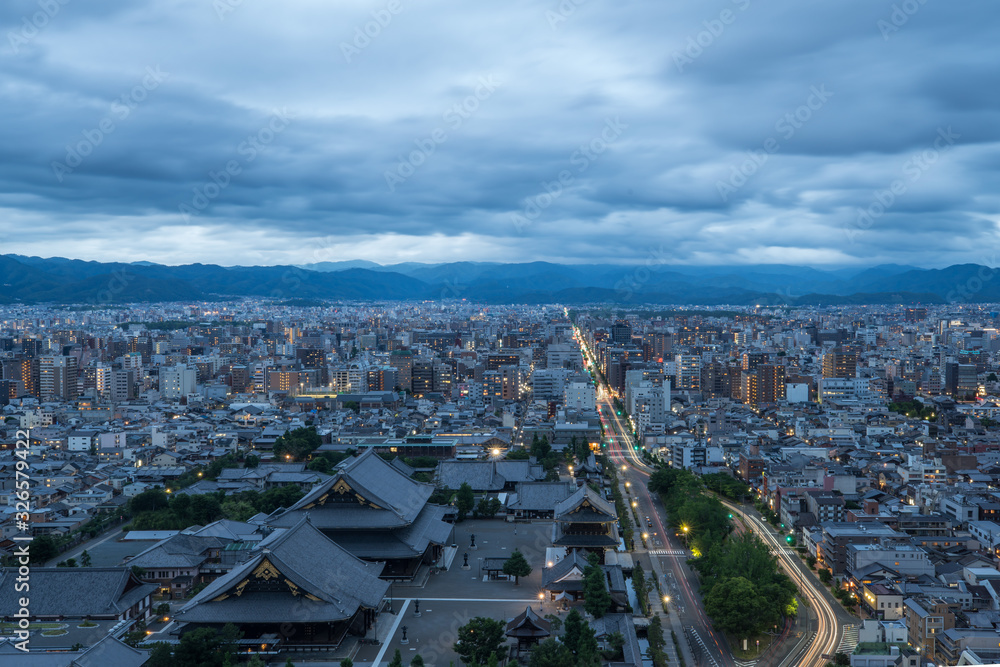 Aerial view of the Kyoto cityscapes during the twilight in a cloudy day, Japan