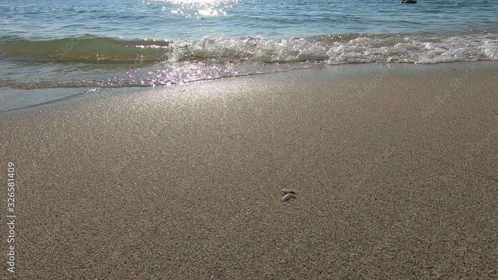 slow motion, sea wave on sand coast beach with beautiful sun light shiny in the morning vacation day slow motion, sea wave on sand coast beach with beautiful sun light shiny in the morning vacation day