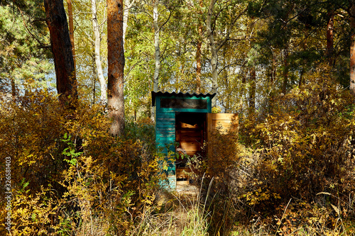 wooden toilet in the forest © Zanger Zheleznogorov