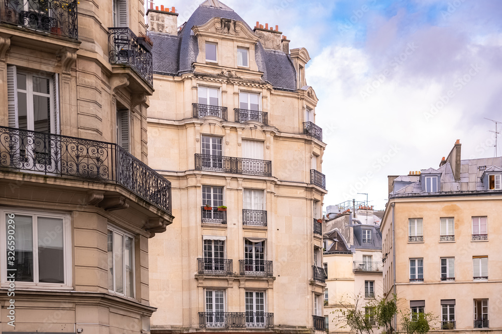 Paris, typical facade and windows, beautiful buildings in the Marais