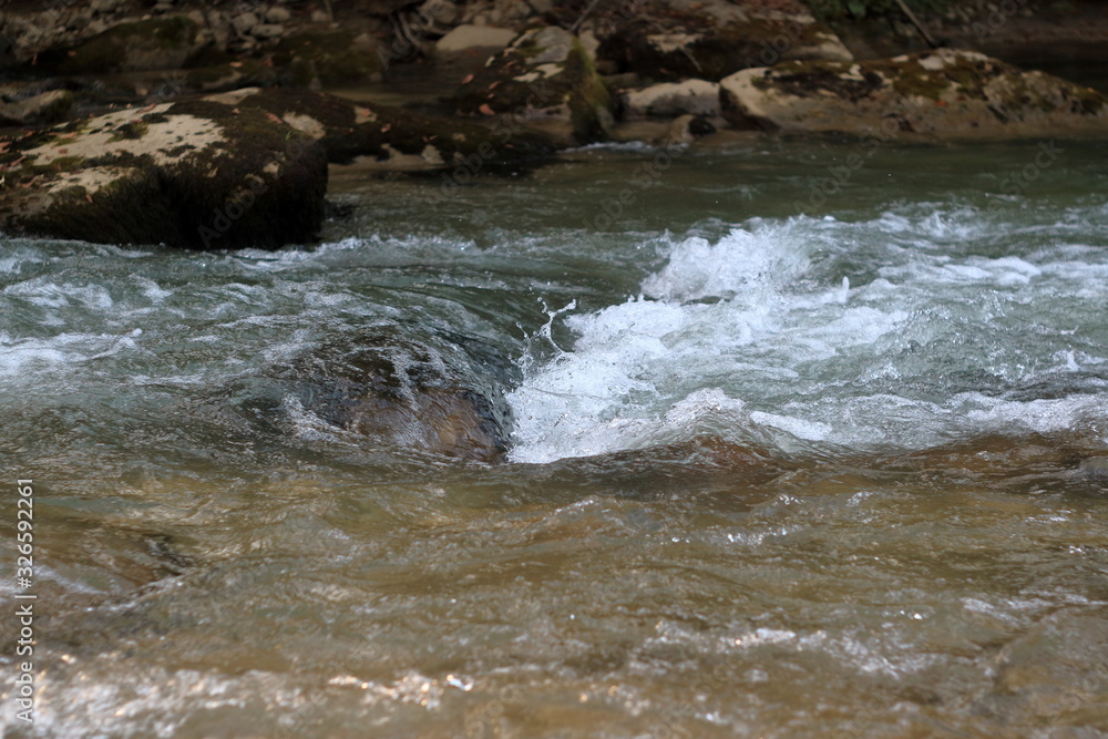 The image of a mountain stream. The image of a mountain stream.